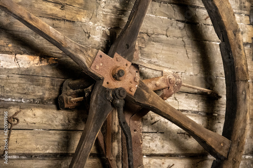 scrap metal parts and old rusty tools in abandoned workshop