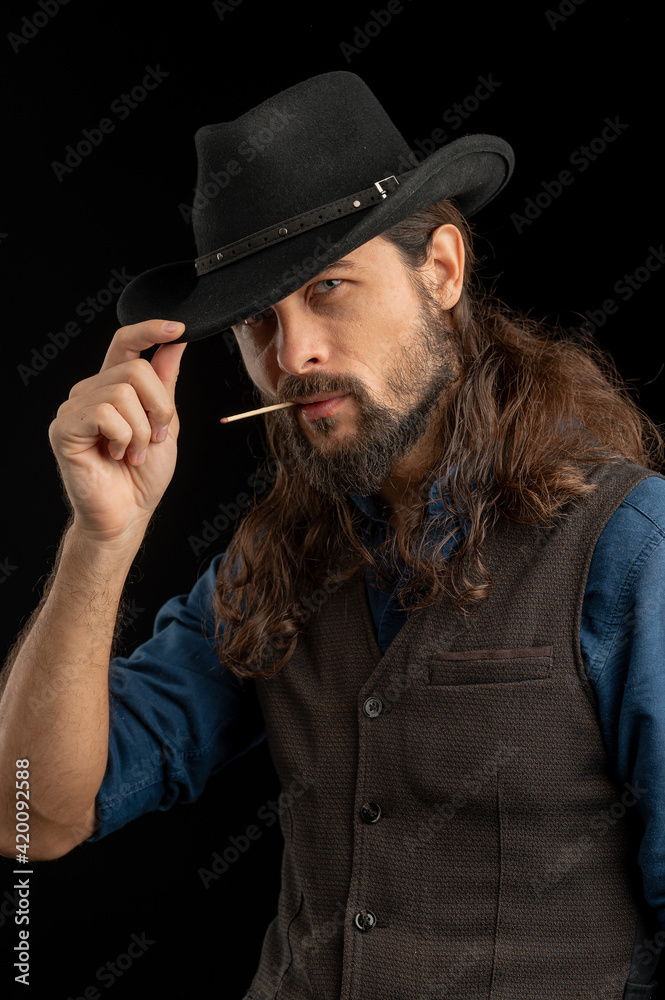 Cowboy with guns. Studio shooting Cowboy with guns. Studio shooting