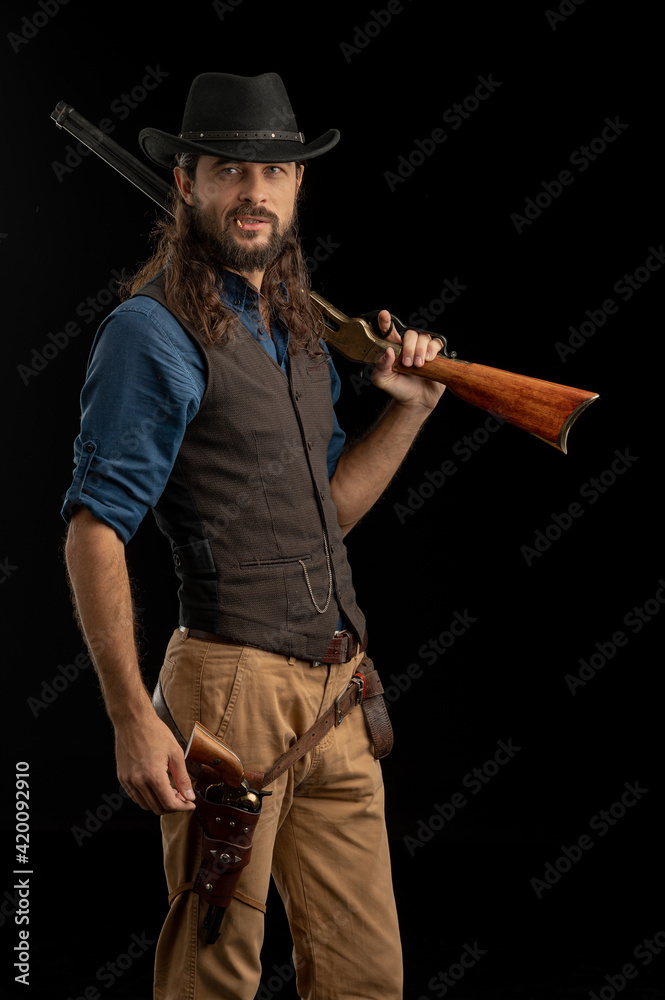 Cowboy with guns. Studio shooting Cowboy with guns. Studio shooting