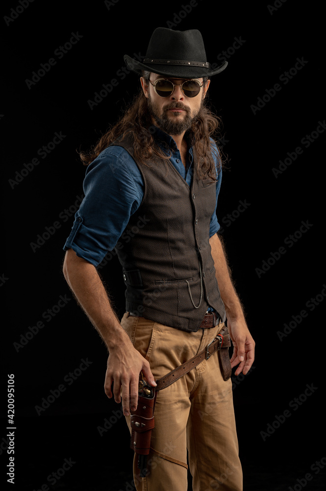 Cowboy with guns. Studio shooting