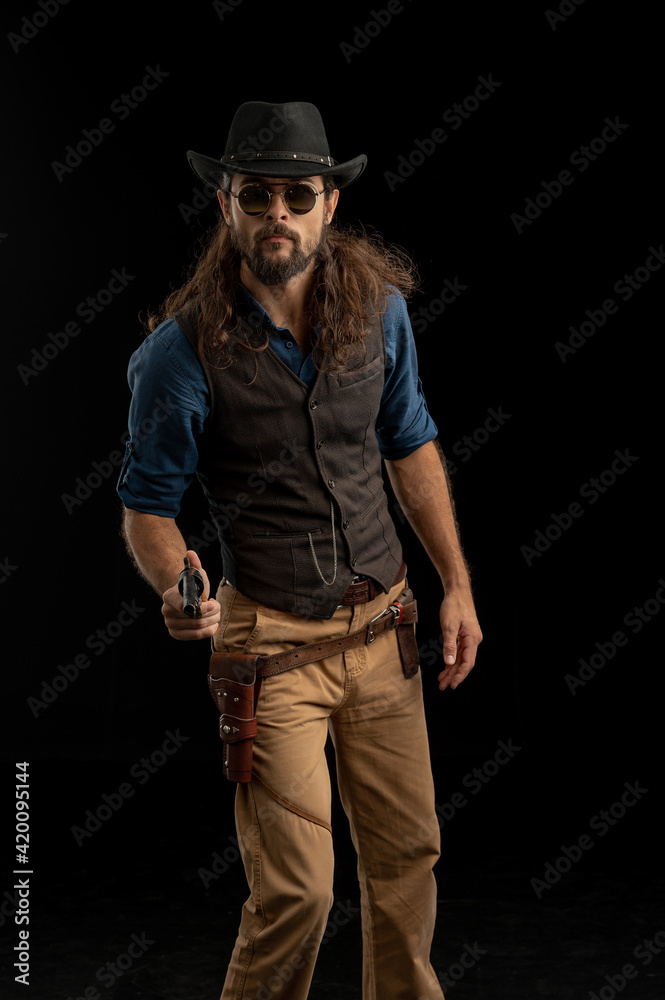 Cowboy with guns. Studio shooting Cowboy with guns. Studio shooting