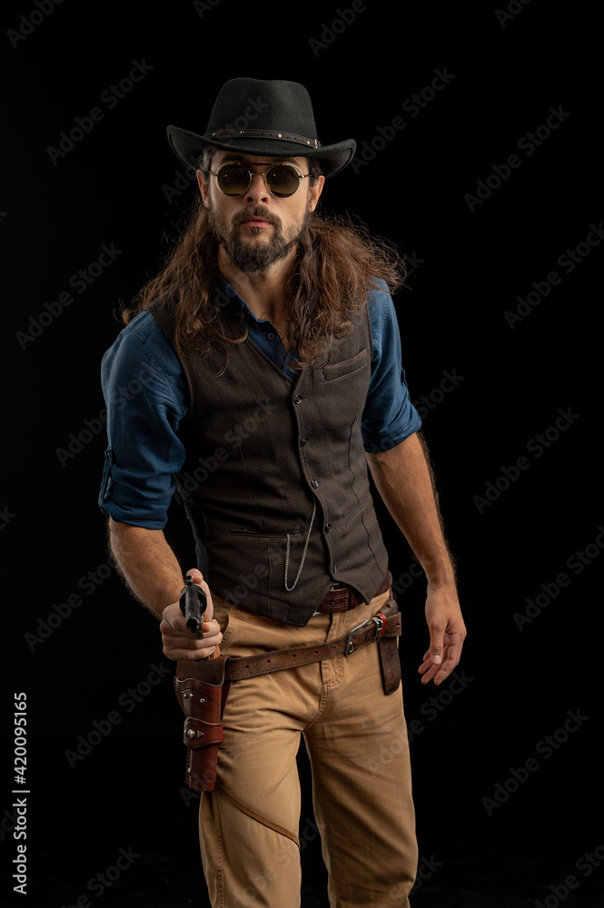 Cowboy with guns. Studio shooting Cowboy with guns. Studio shooting