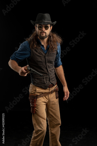 Cowboy with guns. Studio shooting