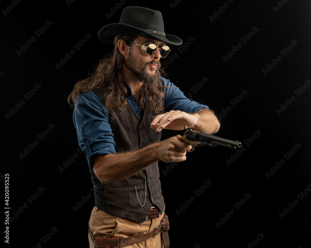Cowboy with guns. Studio shooting Cowboy with guns. Studio shooting