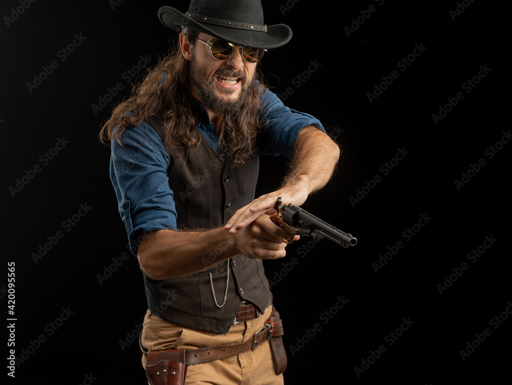 Cowboy with guns. Studio shooting Cowboy with guns. Studio shooting
