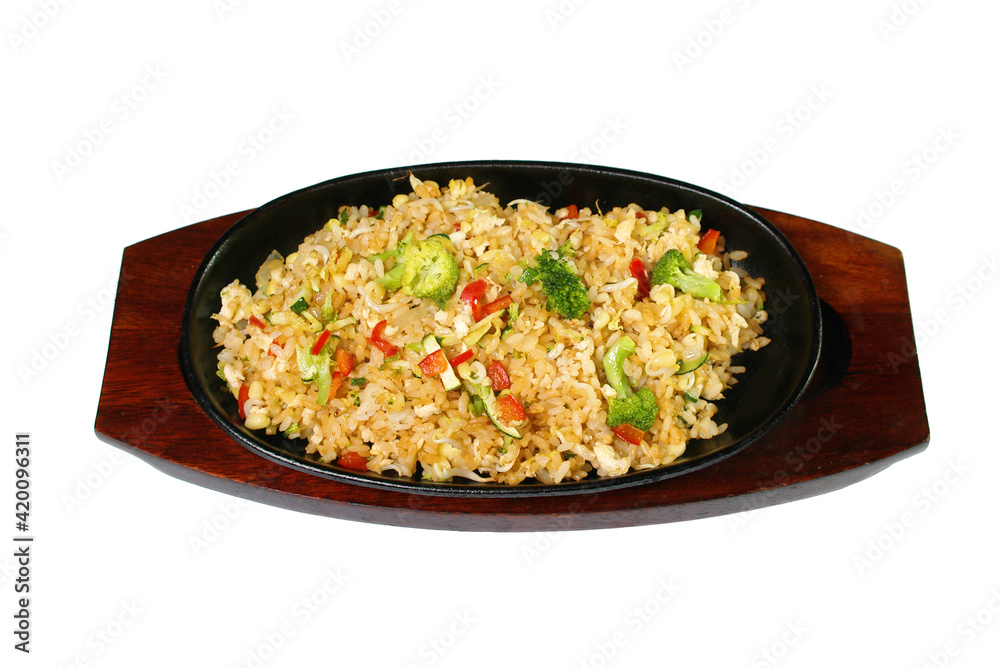 rice with vegetables in a pig-iron frying pan it is isolated on a white background rice with vegetables in a pig-iron frying pan it is isolated on a white background