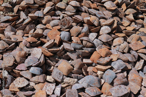 pile of rusty pig iron ingots
 photo