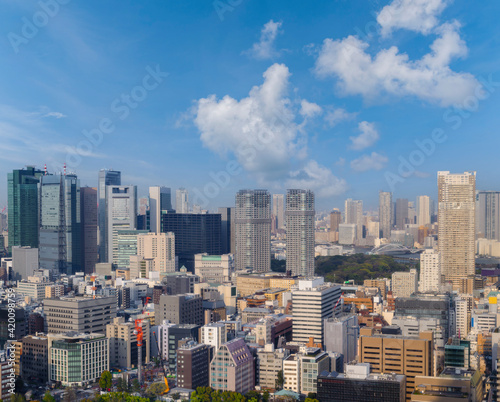 Landscape of tokyo city skyline in Aerial view with skyscraper, modern office building and blue sky background in Tokyo metropolis, Japan. © lukyeee_nuttawut