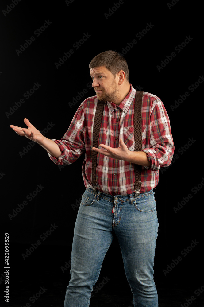 Young stylish man. Studio photo on a black background. Young stylish man. Studio photo on a black background.