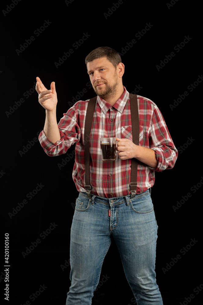 Young stylish man. Studio photo on a black background. Young stylish man. Studio photo on a black background.