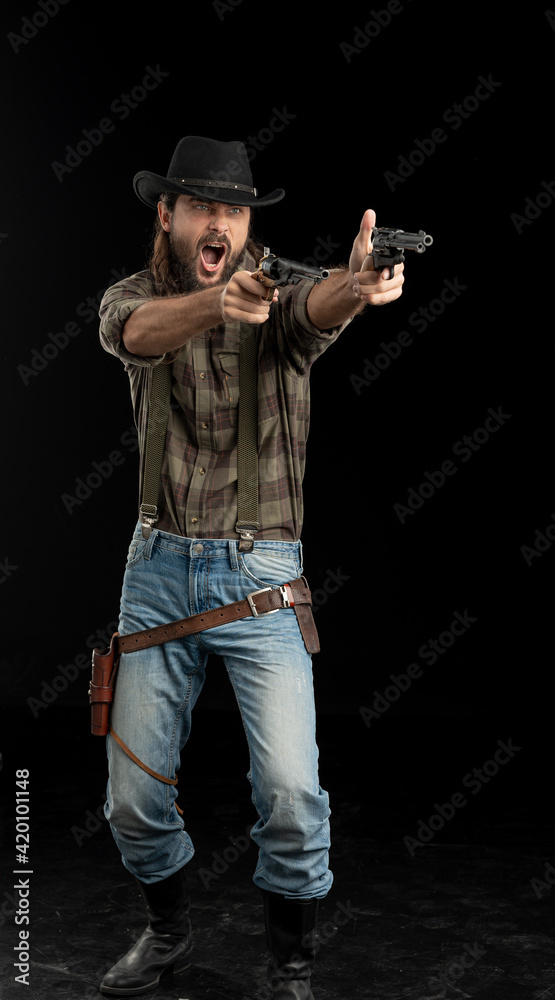 Cowboy with guns. Studio shooting Cowboy with guns. Studio shooting