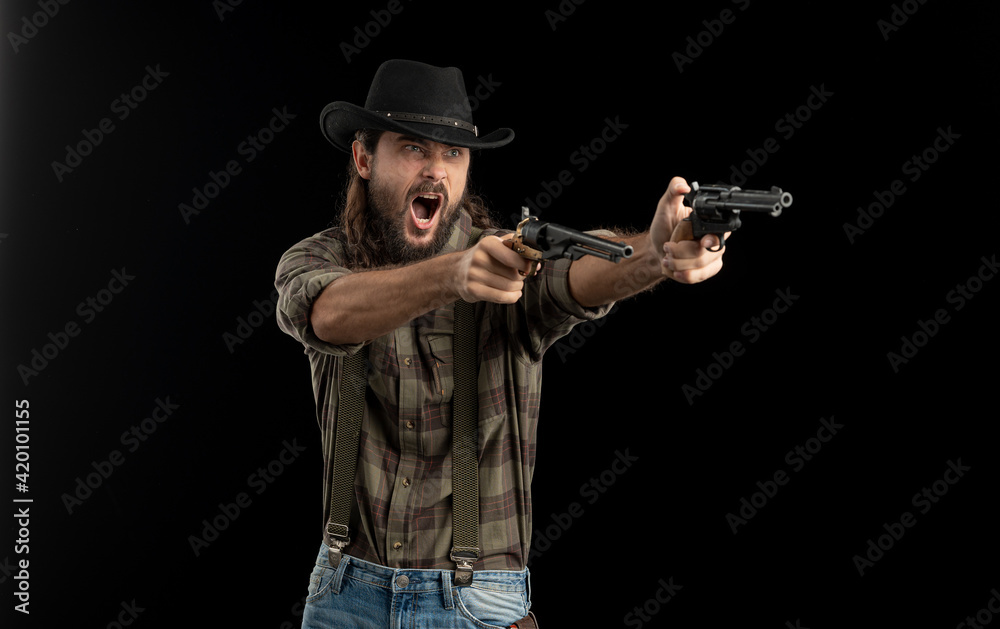 Cowboy with guns. Studio shooting Cowboy with guns. Studio shooting