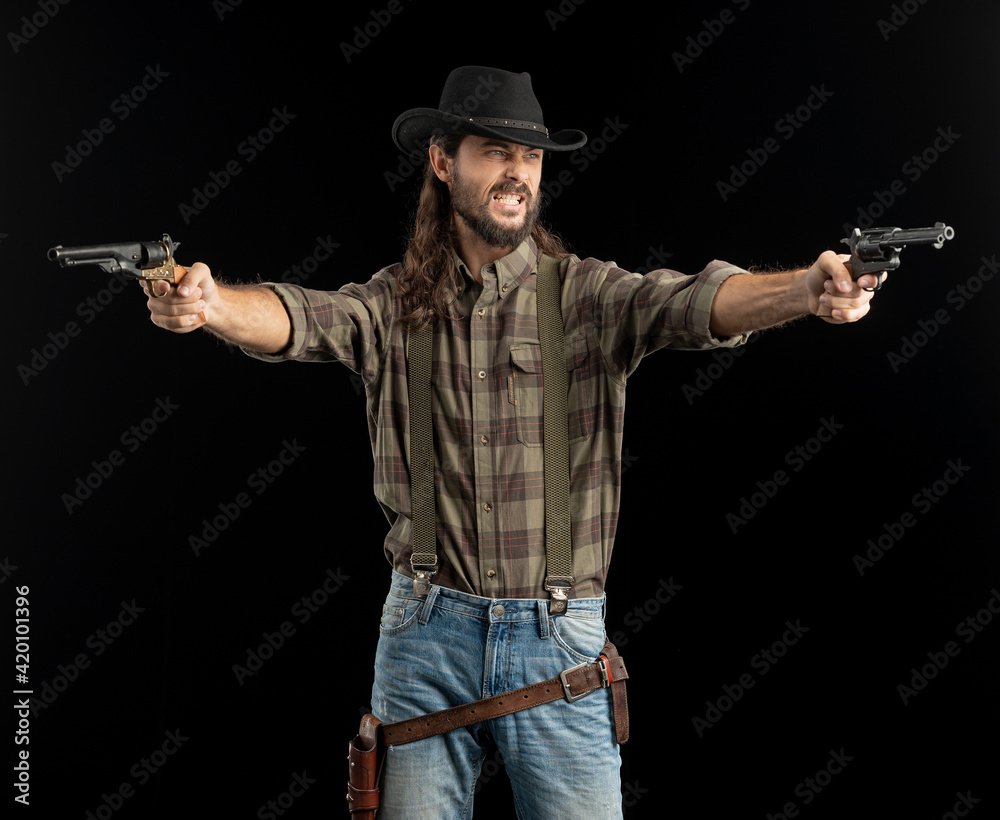 Cowboy with guns. Studio shooting Cowboy with guns. Studio shooting