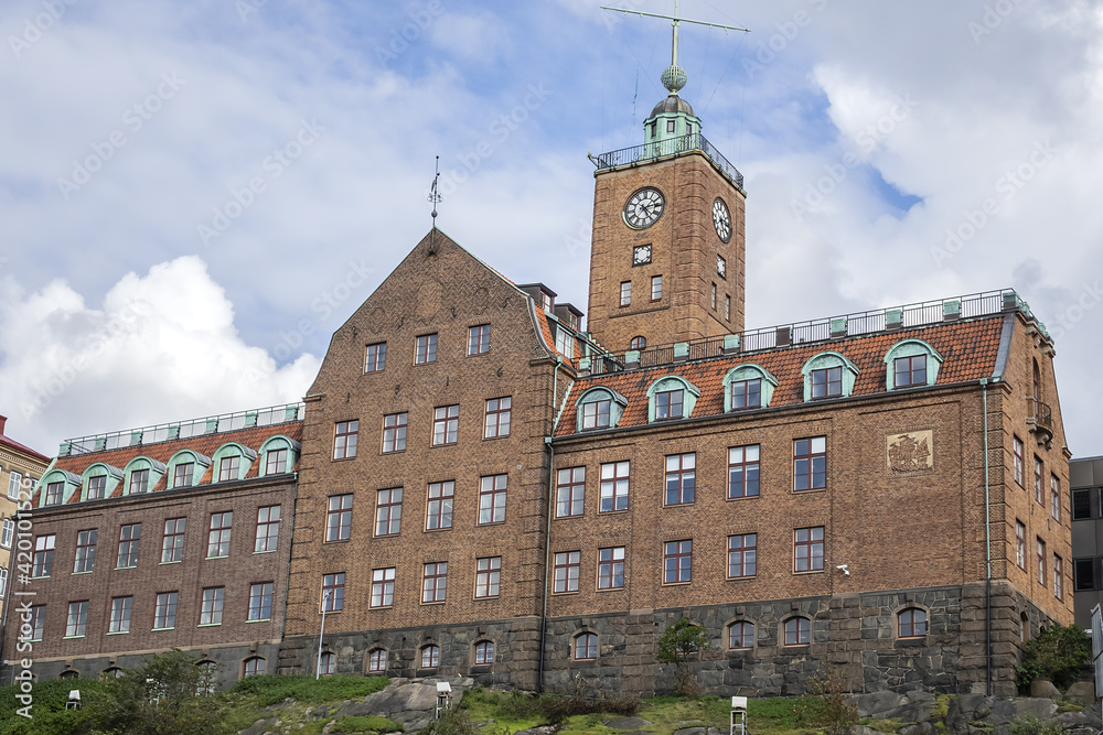 Old red brick building of Navigation school (Navigationsskolan) with time ball in the tower. Gothenburg, Sweden.
