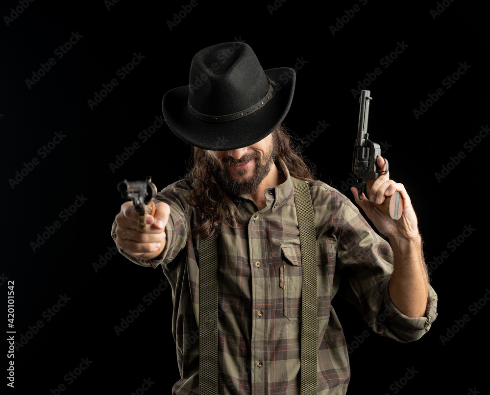 Cowboy with guns. Studio shooting Cowboy with guns. Studio shooting