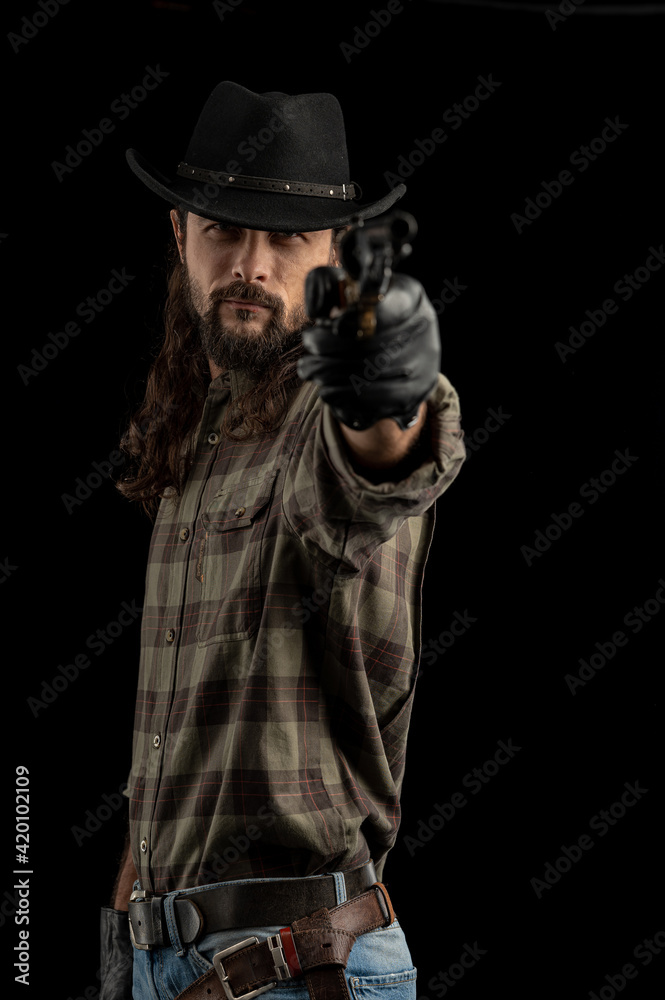 Cowboy with guns. Studio shooting Cowboy with guns. Studio shooting