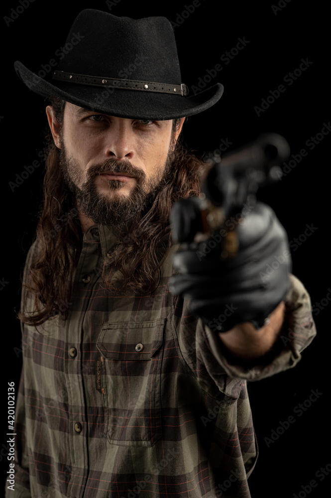 Cowboy with guns. Studio shooting Cowboy with guns. Studio shooting