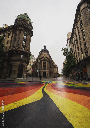 Urban cityscape of historical old building at colorful painted street art bandera in Santiago de Chile South America