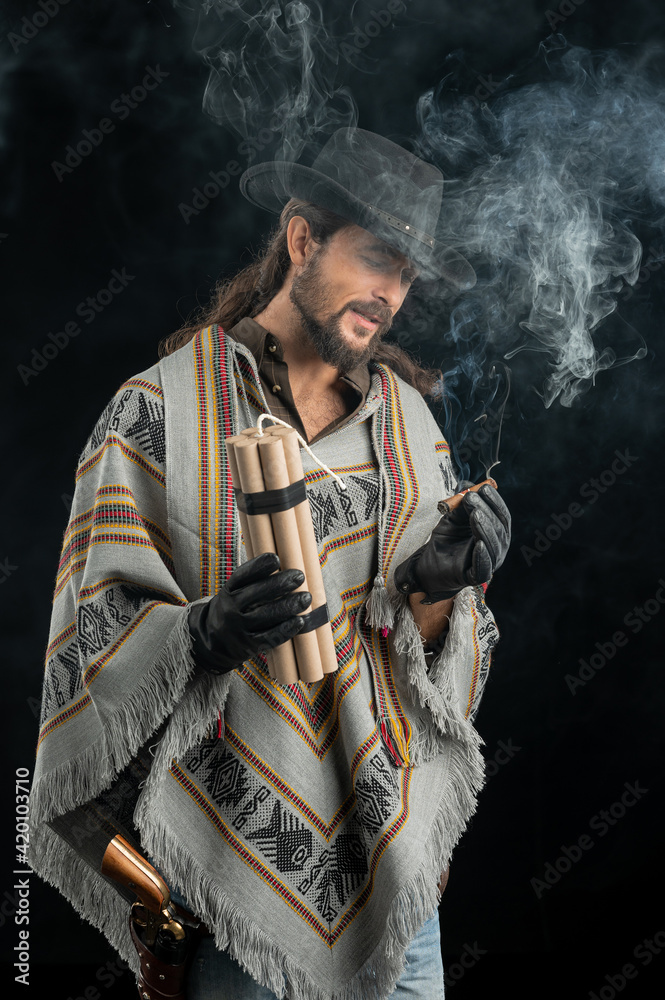 Fototapeta premium Cowboy with guns. Studio shooting