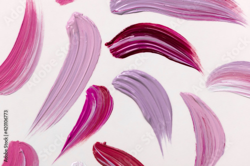 Lilac paint strokes on white.Abstract background.