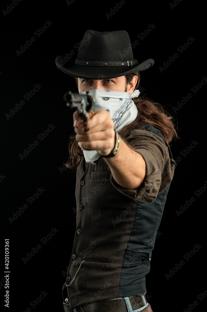 Cowboy with guns. Studio shooting Cowboy with guns. Studio shooting