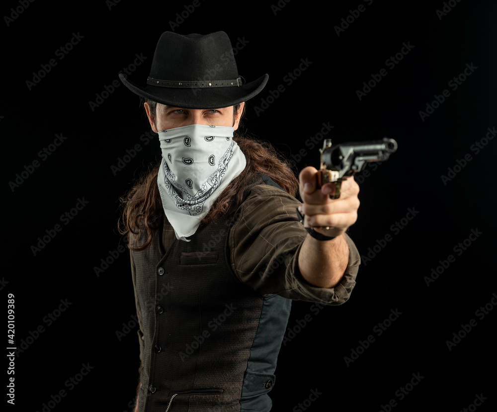 Cowboy with guns. Studio shooting Cowboy with guns. Studio shooting