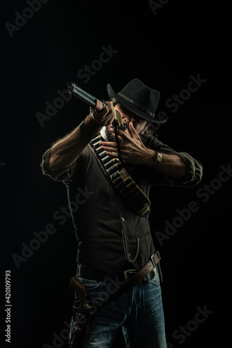 Cowboy with guns. Studio shooting
