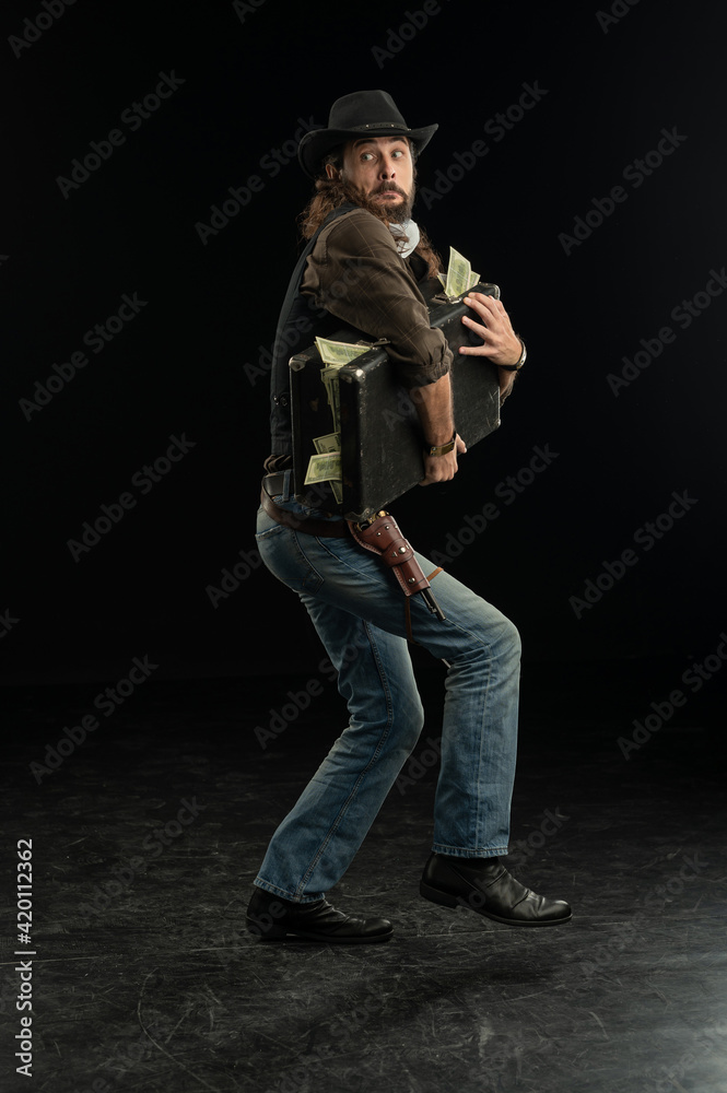 Cowboy with guns. Studio shooting Cowboy with guns. Studio shooting