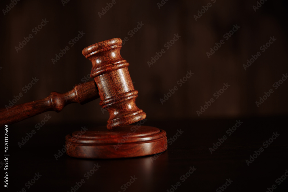 Judge's hammer on wooden table. Justice concept Judge's hammer on wooden table. Justice concept