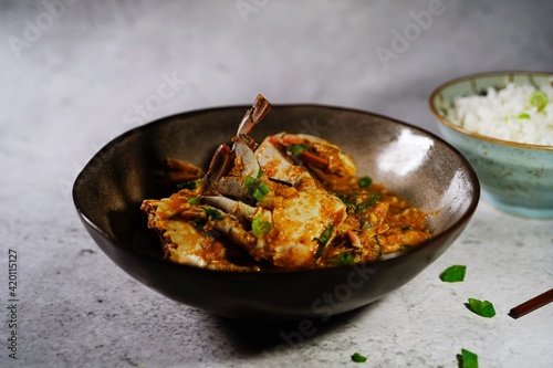 Homemade Singapore chilli crab served with jasmine rice, selective focus