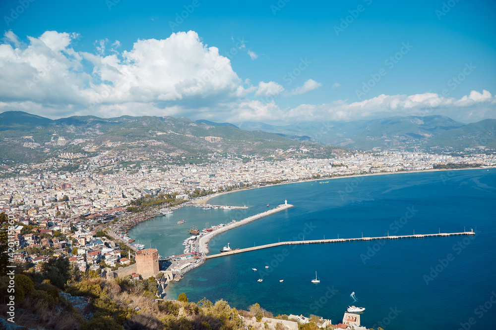 Famous sea panorama landscape of Alanya Castle in Antalya district, Turkey. Popular tourist destination with high mountains. Summer sunny day and beautiful sea 