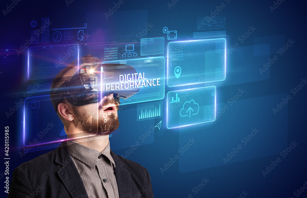 Businessman looking through Virtual Reality glasses, tech concept