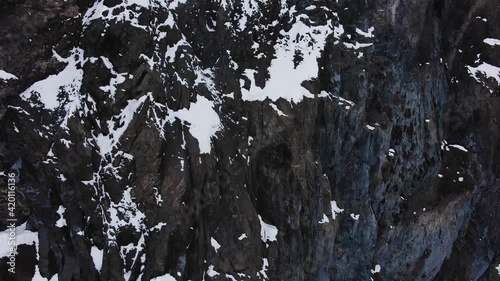 Wallpaper Mural Motion up along cliff to mountain peaks under cloudy sky Torontodigital.ca