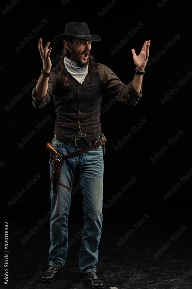 Cowboy with guns. Studio shooting