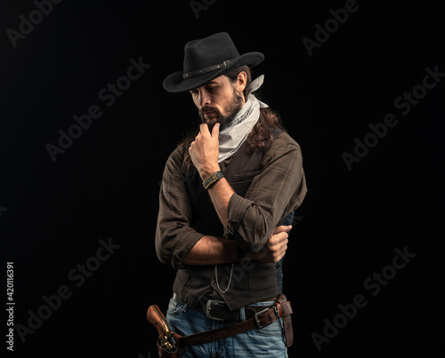 Cowboy with guns. Studio shooting
