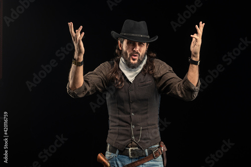 Cowboy with guns. Studio shooting