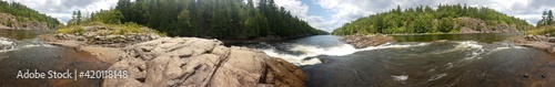 Panoramic picture of the Recollet Falls of the French River near Hwy. 69 and the ongoing French River surrounded by a mixed forest