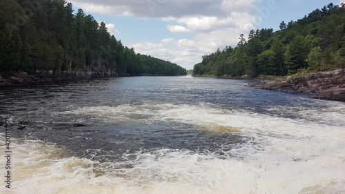 Panoramic picture of the Recollet Falls of the French River near Hwy.69 and the ongoing French River surrounded by a mixed forest.