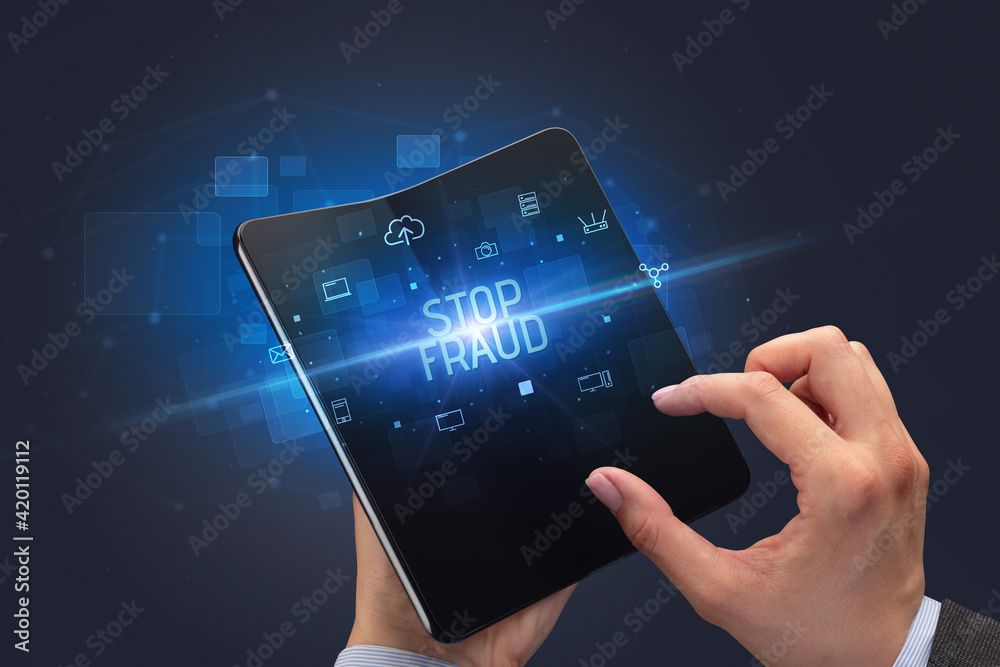 Businessman holding a foldable smartphone, security concept Businessman holding a foldable smartphone, security concept