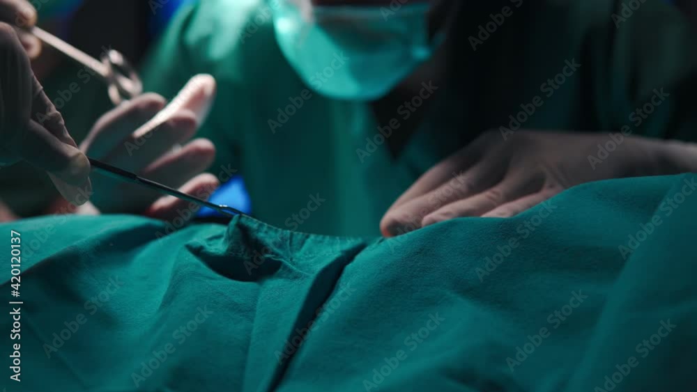 B roll of Demonstration or simulation of surgery in a hospital.  Asian doctor in the operating room for surgical. Surgery beauty clinic in hospital healthcare concept. Beauty clinic and health concept