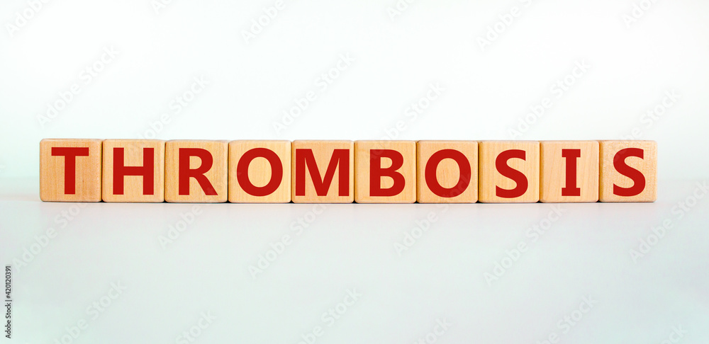 Medical and and thrombosis symbol. Wooden cubes with the word 'thrombosis'. Beautiful white background. Medical and thrombosis concept. Copy space. Medical and and thrombosis symbol. Wooden cubes with the word 'thrombosis'. Beautiful white background. Medical and thrombosis concept. Copy space.