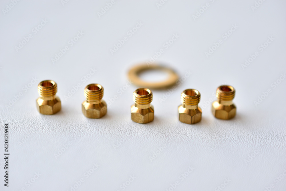 Golden gas burner nozzle bolt on white background Golden gas burner nozzle bolt on white background