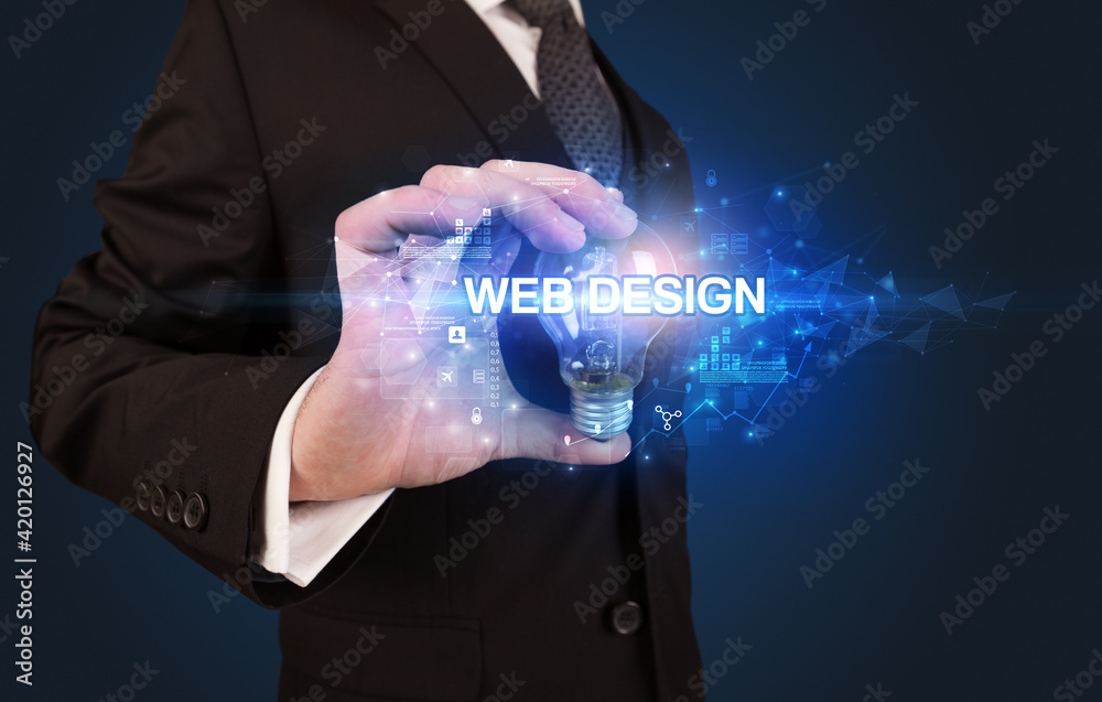 Obraz premium Businessman holding a light bulb
