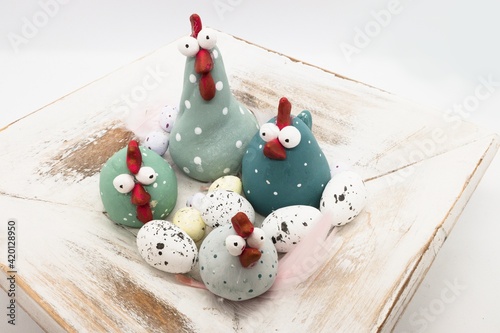 Easter decoration made of colorful blue dotted chicken. Polymer clay idea.