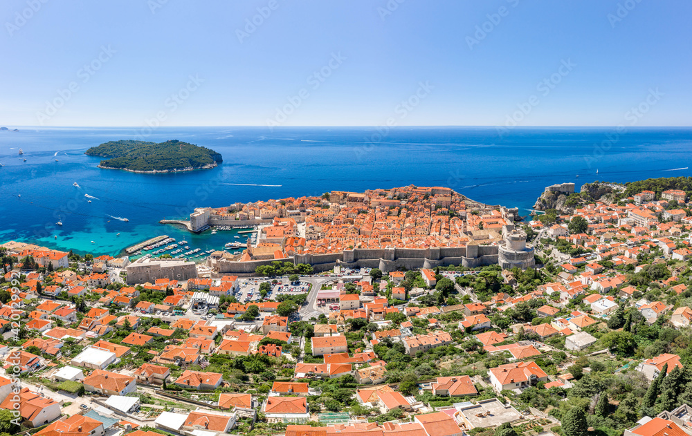 Aerial drone shot Adriatic coastline in Dubrovnik old town in Croatia summer noon
