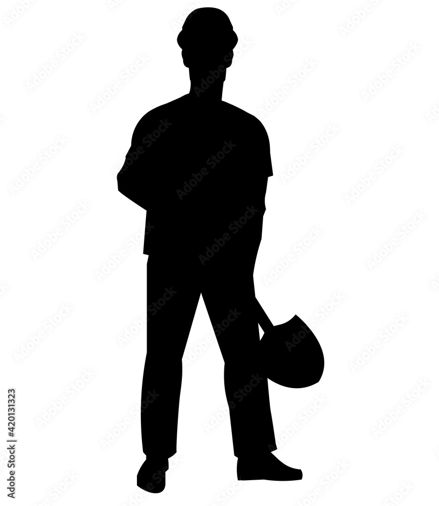Silhouette of a worker in work clothes and a hard hat standing with a shovel in his hands and preparing to dig a hole Silhouette of a worker in work clothes and a hard hat standing with a shovel in his hands and preparing to dig a hole