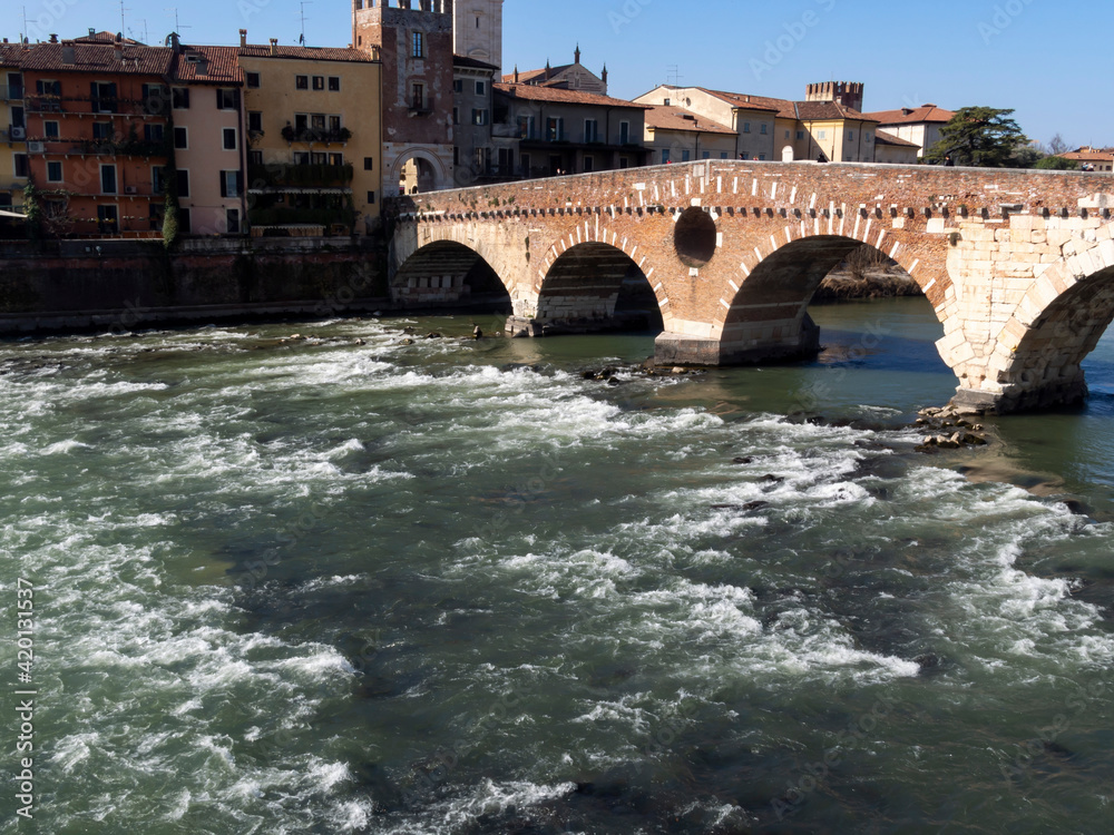 The Ponte di Pietra (Stone Bridge), is the oldest bridge in Verona, is a Roman arch bridge that crosses the Adige River.
Under the bridge, the water bumps on the rocks.
