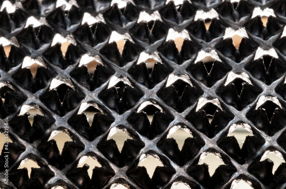 Fototapeta premium Metal knurled surface closeup view backlit