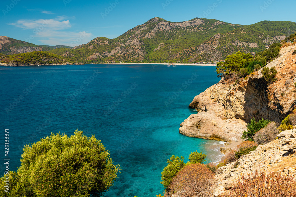 Beautiful beach with blue water near Oludeniz town on the coast of Mugla region in Turkey