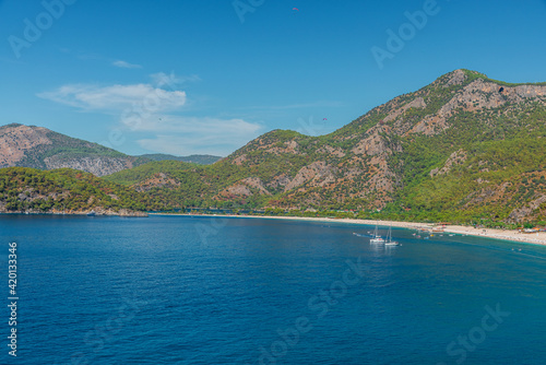 Beautiful view of sea coast in Oludeniz town in Mugla region, Turkey with turquoise water and mountains